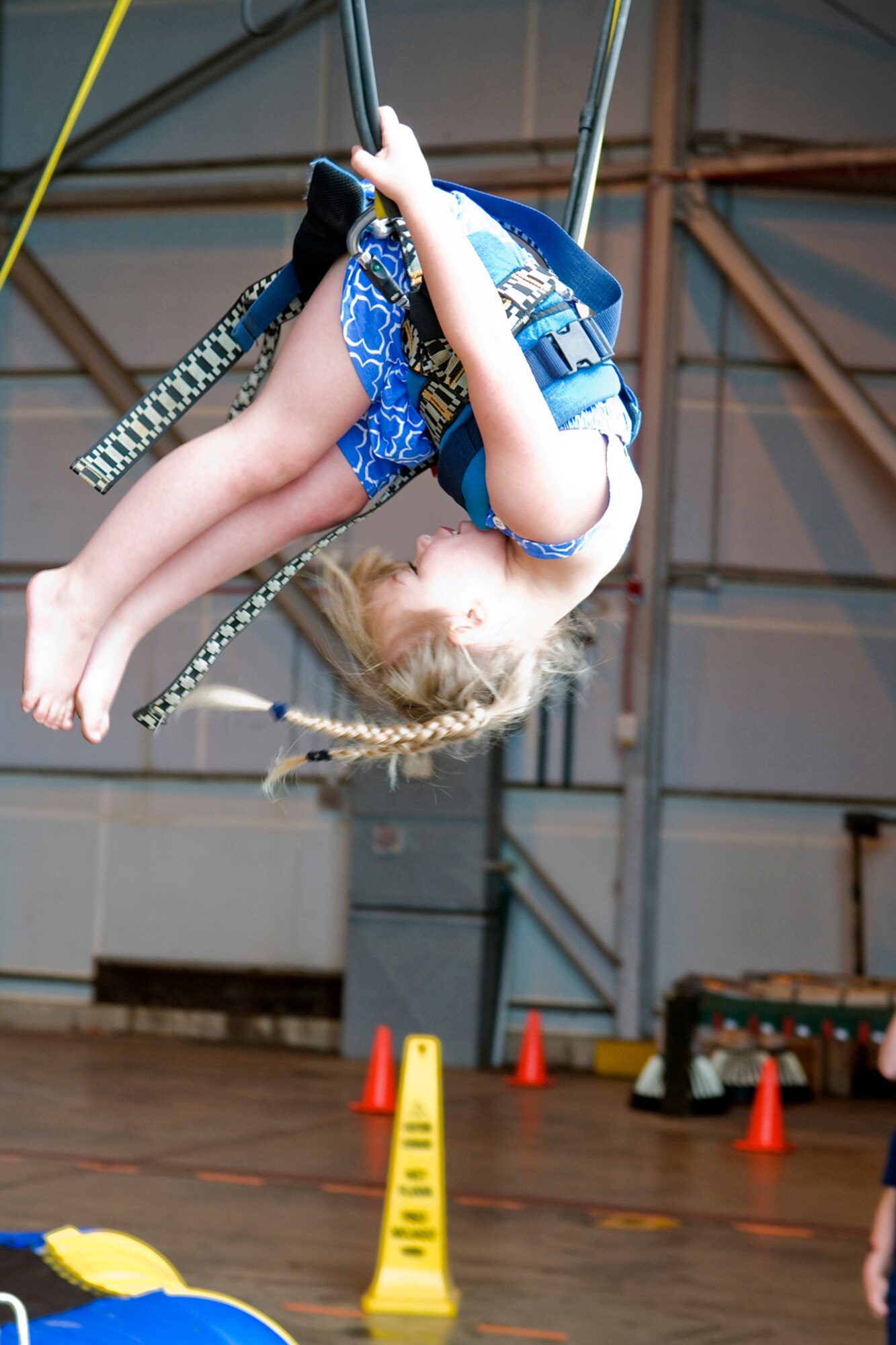 Addison Karagias attempts a flip during Grissom's annual Family Appreciation Day here June 1, 2013. Addison is the daughter of Capt. Theodore Karagias, 434th Aircraft Maintenance Squadron maintenance officer. (U.S. Air Force photo/Senior Airman Jami K. Lancette) 