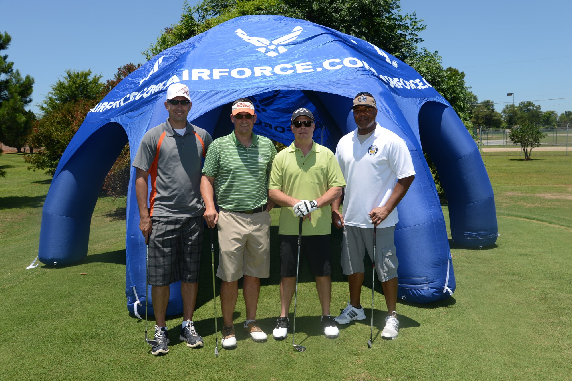 (From left), U.S. Air Force Capt. Jeremy Kinne, 20th Fighter Wing executive officer, U.S. Air Force Col. Clay Hall, 20th Fighter Wing commander, U.S. Air Force Col. Lance Kildron, 20th Fighter Wing vice commander, and Chief Master Sgt. James Wilkerson, 20th Fighter Wing command chief pose for a photo before teeing off on hole five during the Shaw Chief’s Group annual golf tournament June 14, 2013, Shaw Air Force Base, S.C. (U.S. Air Force photo by Airman 1st Class Jonathan Bass/Released)