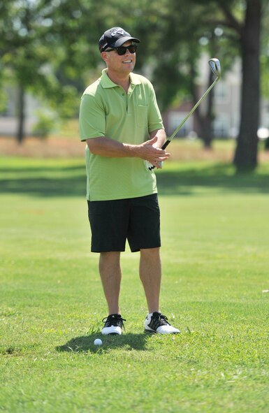 U.S. Air Force Col. Lance Kildron, 20th Fighter Wing vice commander, eyes his shot and mentally prepares to make his swing during the Shaw Chief’s Group’s annual golf tournament June 14, 2013, Shaw Air Force Base, S.C.. While competing for the lowest score, golfers had challenges including a longest drive competition, closest to the pin, and putting contest. (U.S. Air Force photo by Airman 1st Class Jonathan Bass/Released)