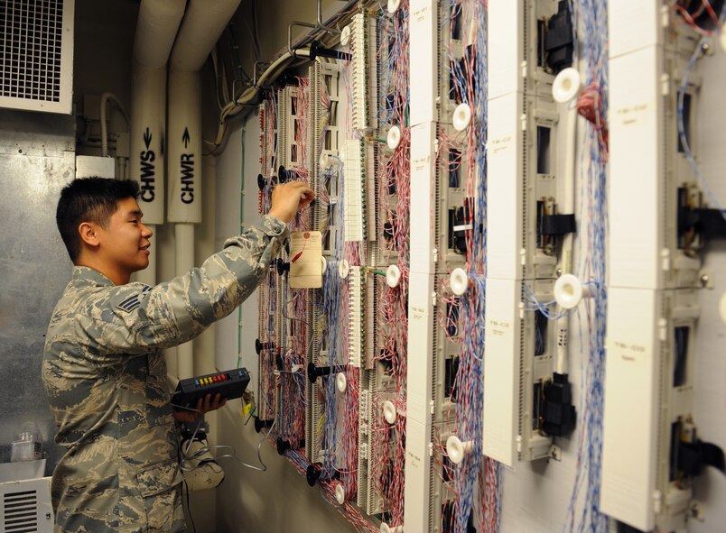 Senior Airman Jeffrey Sales, 2nd Communications Squadron airfield systems technician, checks the line quality of a telephone line at the Air Traffic Control tower on Barksdale Air Force Base, La., June 17, 2013. The tower uses its own internal communications systems which 2nd CS airfield systems technicians maintain. (U.S. Air Force photo/Airman 1st Class Benjamin Gonsier)