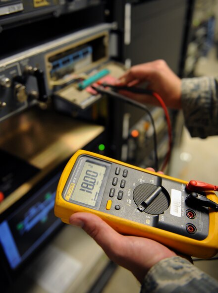 Senior Airman Christopher Ries, 2nd Communications Squadron airfield systems technician, checks the voltage on a communication system on Barksdale Air Force Base, La., June 17, 2013. A voltmeter is used to check the power of equipment to ensure it is working correctly. (U.S. Air Force photo/Airman 1st Class Benjamin Gonsier) 