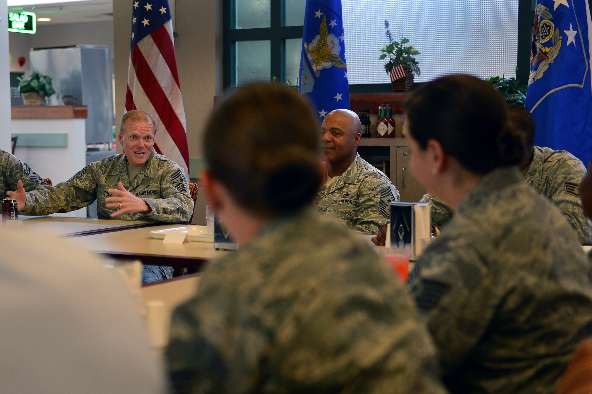 Chief Master Sgt. of the Air Force James Cody talks with members of Team Shaw while having lunch at Shaw Air Force Base, S.C., June 17, 2013. Cody opened the floor to the Airmen in attendance, giving them the opportunity to ask questions during the meal. (U.S. Air Force photo by Airman 1st Class Krystal M. Jeffers/Released)
