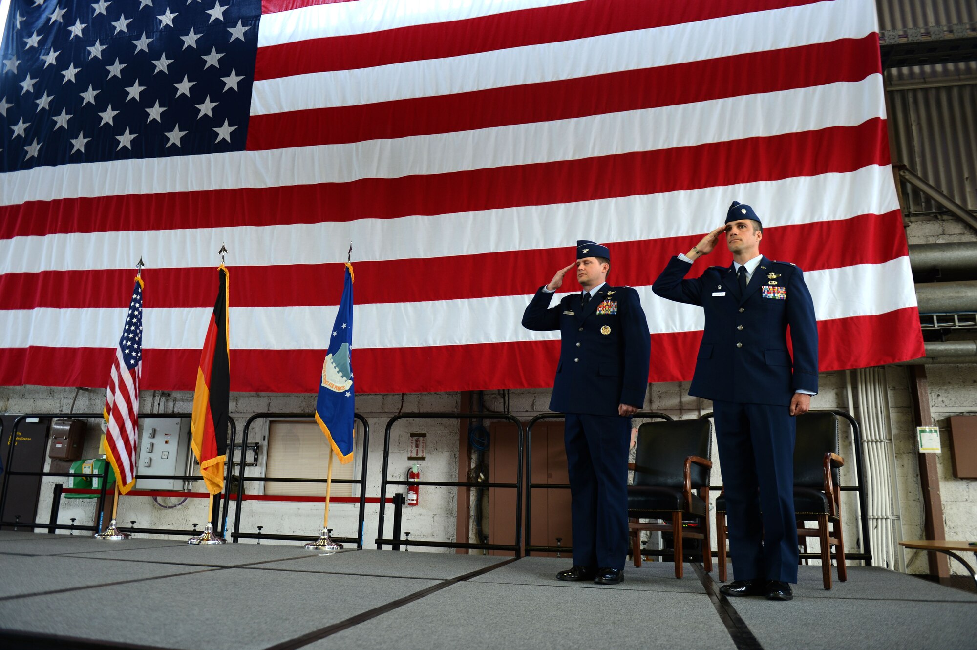 SPANGDAHLEM AIR BASE, Germany – U.S. Air Force Col. David Lyons, 52nd Operations Group commander, and U.S. Air Force Lt. Col. Clinton Eichelberger, 81st Fighter Squadron commander salute during an inactivation ceremony June 18, 2013, at Spangdahlem AB. The Air Force merged missions and cut manning and equipment to stay within its approved budget, resulting in the closure of the 81st FS. (U.S. Air Force photo by Airman 1st Class Gustavo Castillo/Released) 