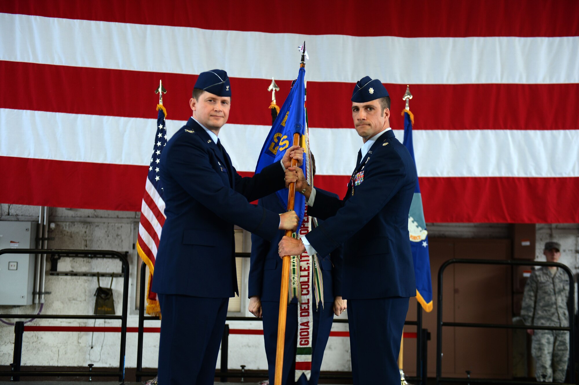 SPANGDAHLEM AIR BASE, Germany – U.S. Air Force Lt. Col. Clint Eichelberger, right, 81st Fighter Squadron commander, passes his unit’s guidon to U.S. Air Force Col. David Lyons, 52nd Operations Group commander, during an inactivation ceremony June 18, 2013, at Spangdahlem AB. Since its activation 71 years ago, the 81st FS has flown eight different aircraft. (U.S. Air Force photo by Airman 1st Class Gustavo Castillo/Released)