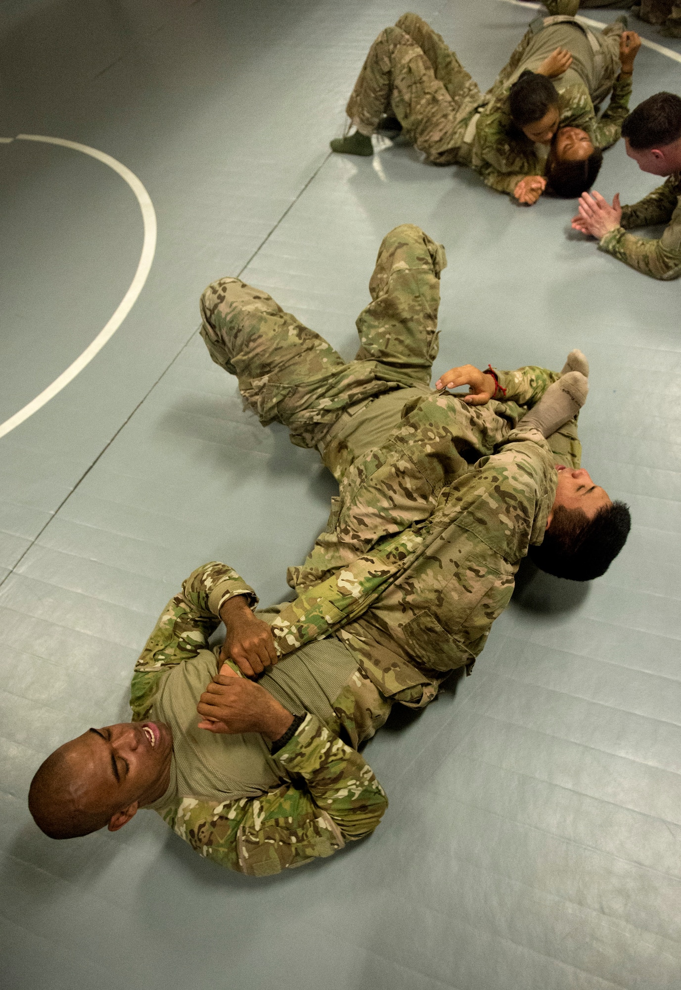 Senior Airman Ivan Shipp, 455th Expeditionary Security Forces Squadron Fly-Away Security Team member, forces Airman 1st Class Everardo Torres into submission during combatives training at Bagram Air Field, Afghanistan, June 9, 2013. FAST members are required to fly on specific missions when a location requires an extra measure of security to ensure the aircraft and crew are protected from hostile fire or on-board security breaches. Shipp hails from Columbus, Ga., and is deployed from Davis-Monthan, Ariz. (USAF Photo/Master Sgt. Ben Bloker)
