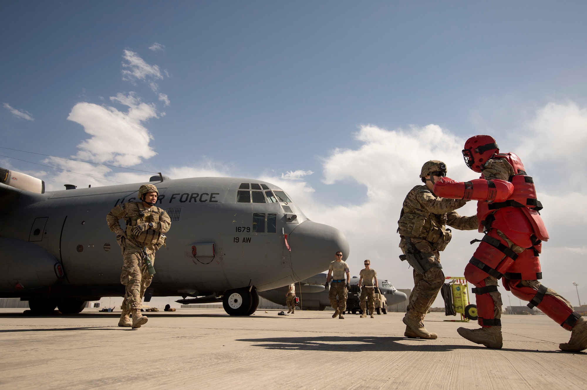 Airman 1st Class Everardo Torres and Melissa Newton, 455th Expeditionary Security Forces Squadron Fly-Away Security Team members, react to an intruder during a hostile training scenario at Bagram Air Field, Afghanistan, June 16, 2013. FAST members are required to fly on specific missions when a location requires an extra measure of security to ensure the aircraft and crew are protected from hostile fire or on-board security breaches. Torres hails from Dallas, Texas, and Newton hails from Big Rock, Iowa. Both are deployed from Davis-Monthan, Ariz.
(USAF Photo/Master Sgt. Ben Bloker)