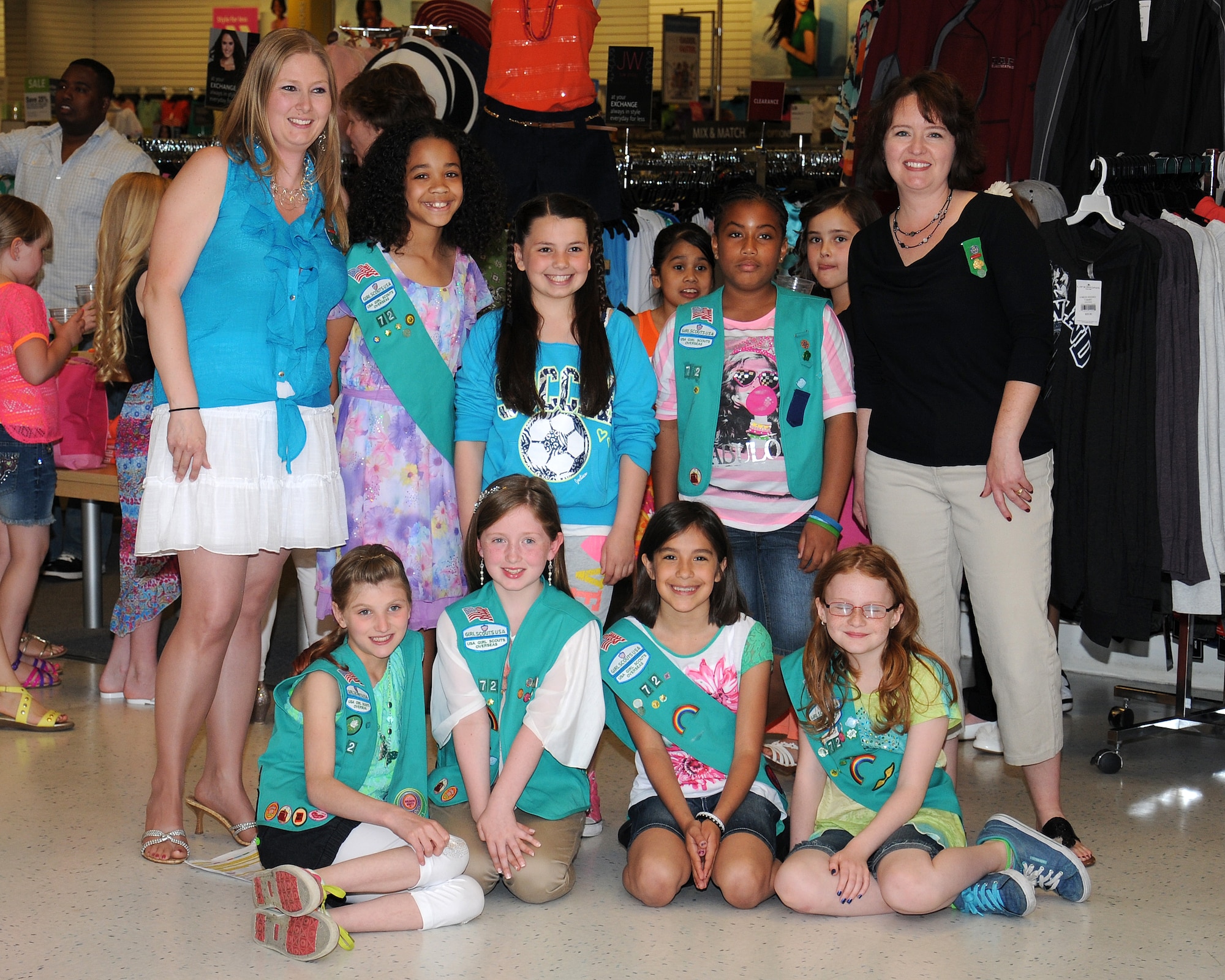 Members of Anglia Girl Scout Junior Troop 72 planned and hosted an event to earn their Girl Scout bronze award June 14, 2013, at RAF Lakenheath, England. Junior Troop 72 is made up of eight girls whose military or Department of Defense parents are stationed or work at RAF Mildenhall or RAF Lakenheath. The girls chose to plan and host a fashion show in order to collect clothing donations for several local charities as well as for the Majengo Children's Home in Tanzania. (U.S. Air Force photo by Gina Randall/Released)