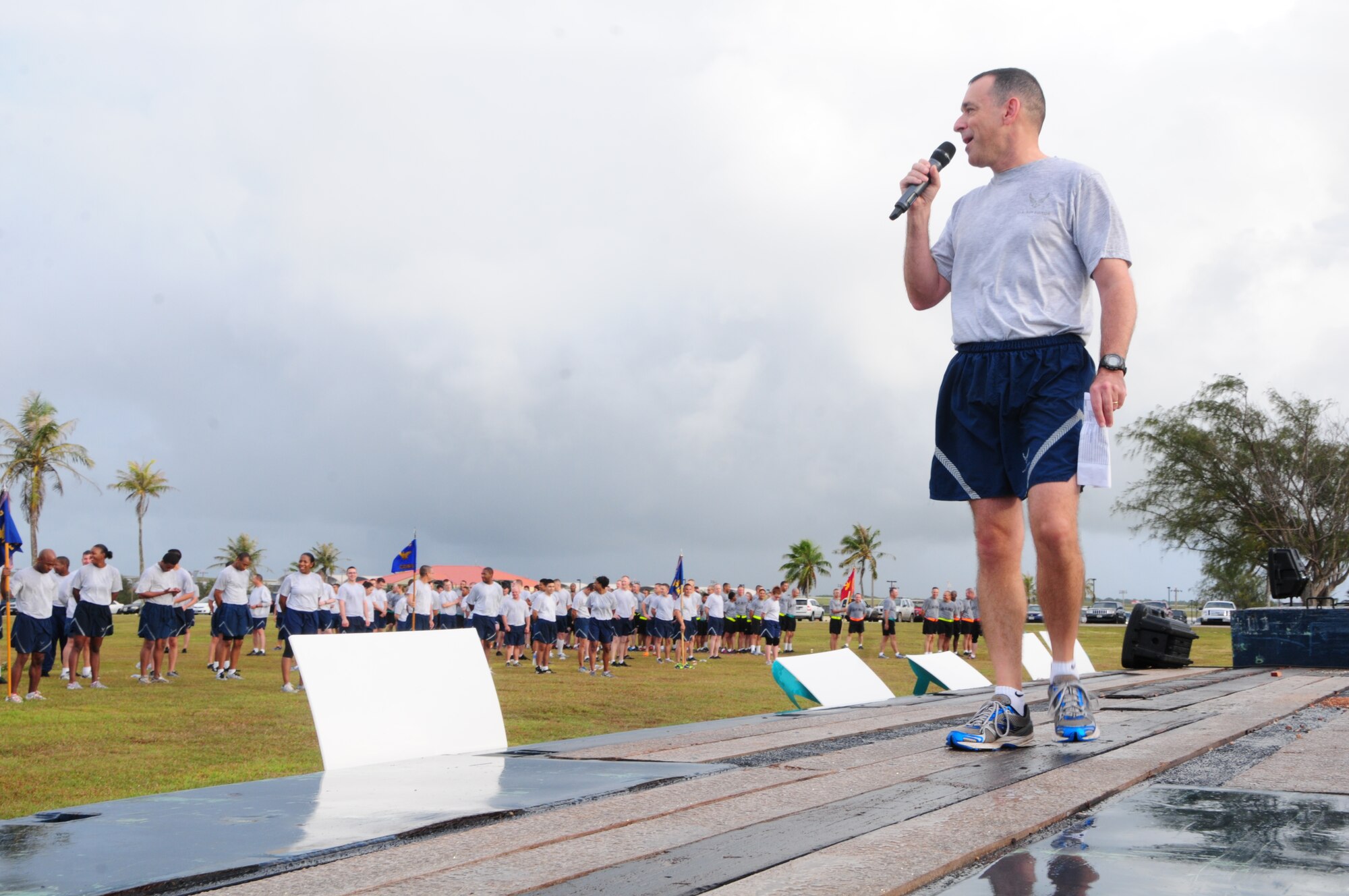 Chief Master Sgt. James Slisik, 36th Wing command chief master sergeant, addresses Team Andersen at a Wing run at Andersen Air Force Base, Guam, June 14, 2013. Approximately 1,000 service members from the Air Force, U.S. Army and U.S. Navy participated in the run. (U.S. Air Force photo By Airman 1st Class Mariah Haddenham/Released)