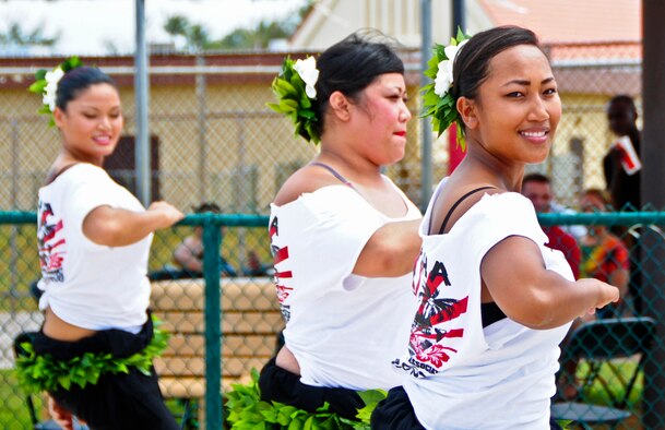 Hula dancers perform for service members June 14, 2013, during a Dorm Dweller and Deployer Appreciation Day event on Andersen Air Force Base, Guam. The 36th Wing Chapel-funded event was hosted by the 36th Maintenance Group, who organized island-themed performances and games. (U.S. Air Force photo by Airman 1st Class Marianique Santos/Released) 