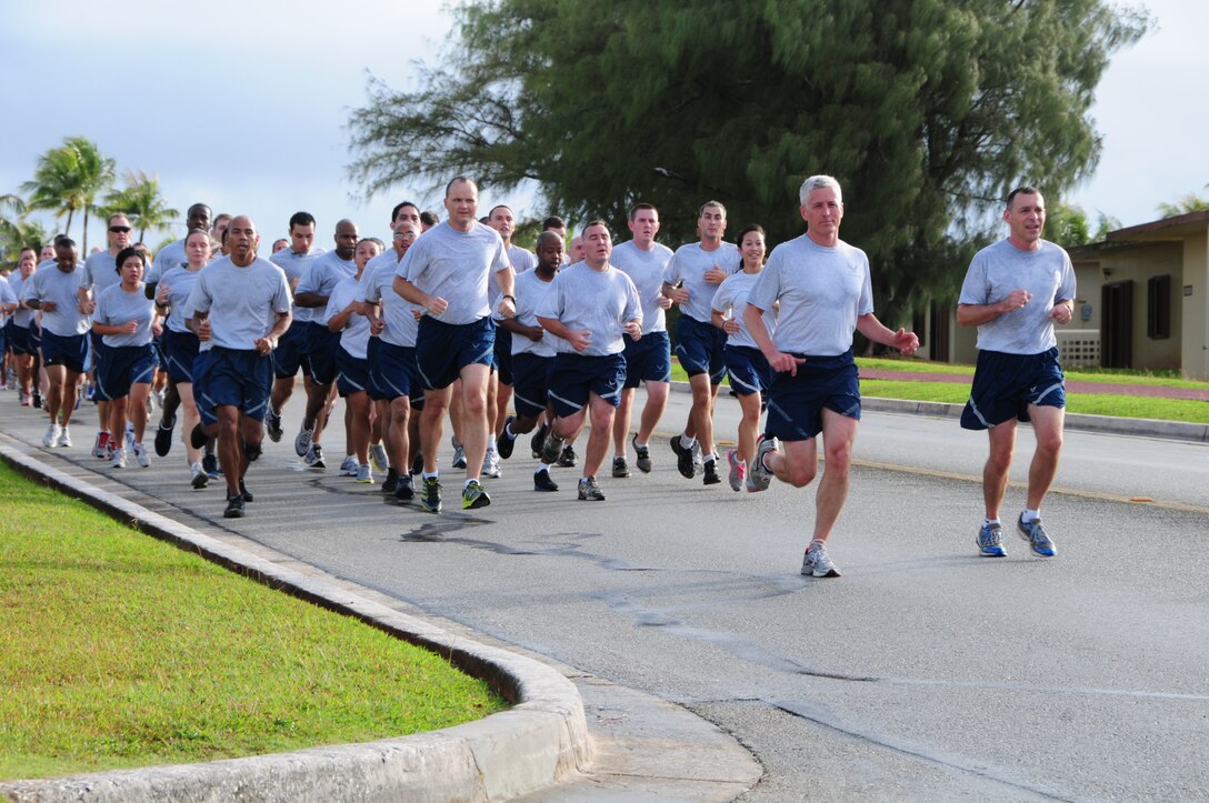 Col. Drechsler, 36th Wing vice commander, leads the Team Andersen in a Wing run at Andersen Air Force Base, Guam, June 14, 2013. Approximately 1,000 service members from the Air Force, U.S. Army and U.S. Navy participated in the run. (U.S. Air Force photo By Airman 1st Class Mariah Haddenham/Released)