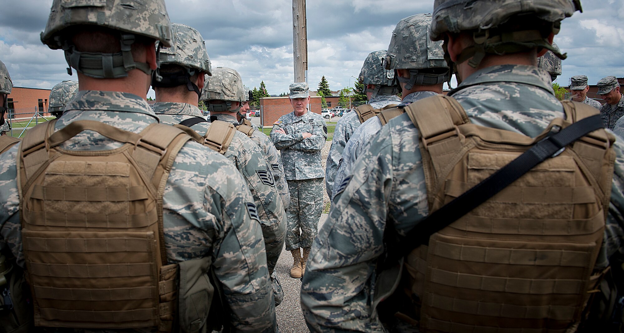 MINOT AIR FORCE BASE, N.D. -- Chairman of the Joint Chiefs of Staff Army Gen. Martin E. Dempsey speaks with Airmen from the 91st Missile Wing security forces during a tour of the base here, June 17. During his first visit to Minot, the general toured the base, met Airmen from the 5th Bomb Wing and 91st MW, and spoke at a Town Hall meeting at the base’s Dock 1. General Dempsey is the 18th Chairman of the Joint Chiefs of Staff. (U.S. Air Force photo/Tech. Sgt. Aaron Allmon)