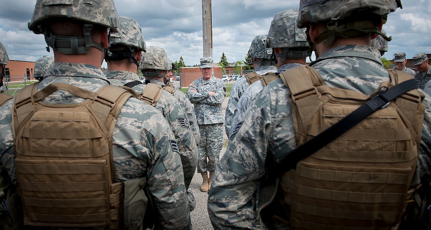 MINOT AIR FORCE BASE, N.D. -- Chairman of the Joint Chiefs of Staff Army Gen. Martin E. Dempsey speaks with Airmen from the 91st Missile Wing security forces during a tour of the base here, June 17. During his first visit to Minot, the general toured the base, met Airmen from the 5th Bomb Wing and 91st MW, and spoke at a Town Hall meeting at the base’s Dock 1. General Dempsey is the 18th Chairman of the Joint Chiefs of Staff. (U.S. Air Force photo/Tech. Sgt. Aaron Allmon)