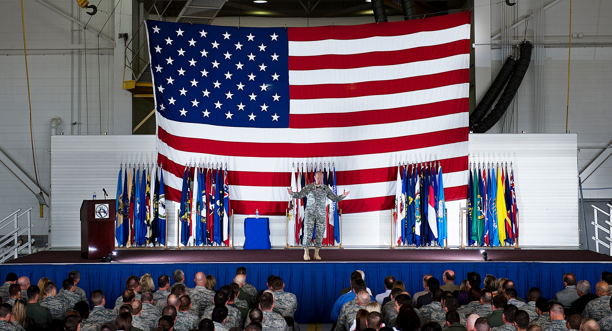 MINOT AIR FORCE BASE, N.D. -- Chairman of the Joint Chiefs of Staff Army Gen. Martin E. Dempsey speaks with Airmen, spouses and local community members during a Town Hall meeting at Dock 1 here, June 17. During his first visit to Minot, the general toured the base and met Airmen from the 5th Bomb Wing and 91st Missile Wing. General Dempsey is the 18th Chairman of the Joint Chiefs of Staff. (U.S. Air Force photo/ Tech. Sgt. Aaron Allmon)