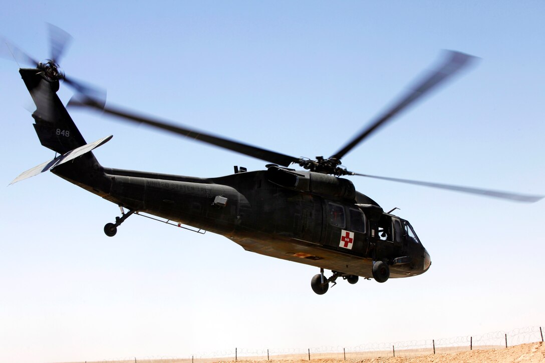 A U.S. Army UH-60 Black Hawk medevac helicopter departs from Combat Outpost Shukvani in Helmand province, Afghanistan, June 8, 2013. The helicopter transported an injured Afghan soldier to another camp for additional medical care.