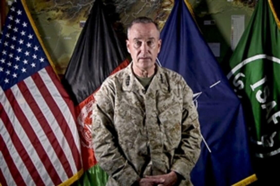 U.S. Marine Corps Gen. Joseph F. Dunford Jr., commander of NATO's International Security Assistance Force, congratulates Afghans in a video message in Kabul, Afghanistan, June 18, 2013, for reaching Milestone 2013. Dunford said Afghan national forces now take the lead for security across their country.