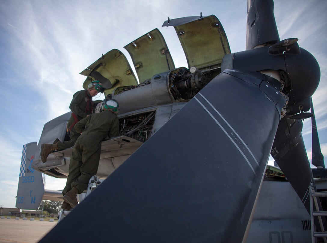 130509-M-WB921-020 MORON DE LA FRONTERA, Spain Lance Corporal Jaryd Stezewski, left, a native of Ceder, Minn., and Lance Cpl. Chris Weimer, a native of Witchita, Kan., both Special-Purpose Marine Air-Ground Task Force Crisis Response avionics technicians, perform routine maintenance on a MV-22 Osprey aboard Moron Air Base, May 9, 2013.
