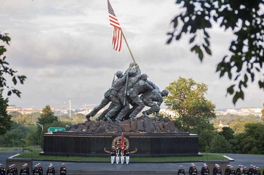 The U.S. Marine Corps Color Guard performs during a Tuesday Sunset Parade at the Marine Corps War Memorial in Arlington, Va., June 18. (Official Marine Corps photo by Lance Cpl. Dan Hosack/Released)