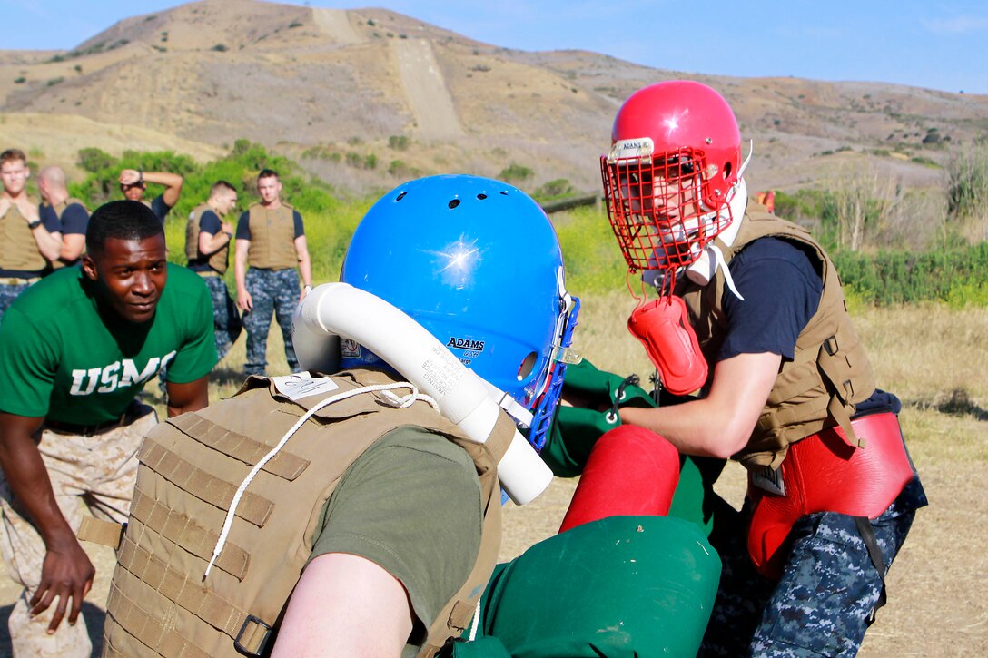 Midshipmen compete in pugil stick matches during Marine Week of Career Orientation and Training for Midshipmen-West 2013 here June 12. Future officers from across the U.S. participated in the four-weeks of training designed to introduce them to career opportunities.