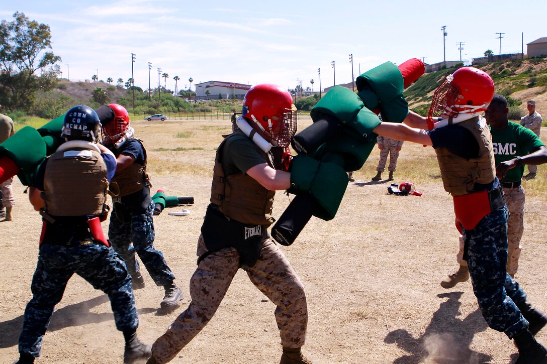 Midshipmen compete in pugil stick matches during Marine Week of Career Orientation and Training for Midshipmen-West 2013 here June 12. Future officers from across the U.S. participated in the four-weeks of training designed to introduce them to career opportunities.
