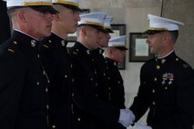 Capt. Joseph Leonardelli, Officer Selection Officer, congratulates newly commissioned Second Lieutenants from RS Milwaukee on taking their first steps as Marine Corps Officers, May 31. From left to right: 2nd Lts. Anthony Grandprey, Everett Brown, Jack Turek, Dustin Blanchard and Ryan Graves.