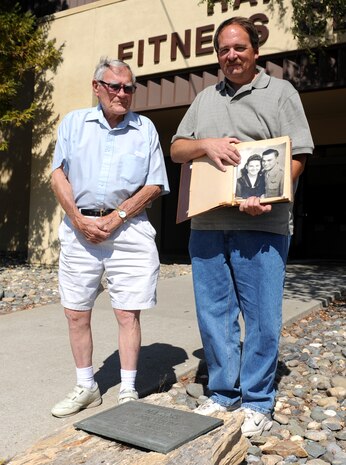Larry Harris (left), brother of 2nd Lt. Everett Harris, and Larry Harris Jr., nephew of Everett, visit a plaque dedicated to Everett at Beale Air Force Base, Calif., June 8, 2013. On Nov. 14, 1966, the Harris Fitness Center was named after Everett a P-38 Lightning reconnaissance pilot who was killed in action during World War II. (U.S. Air Force photo by Airman 1st Class Bobby Cummings/Released)