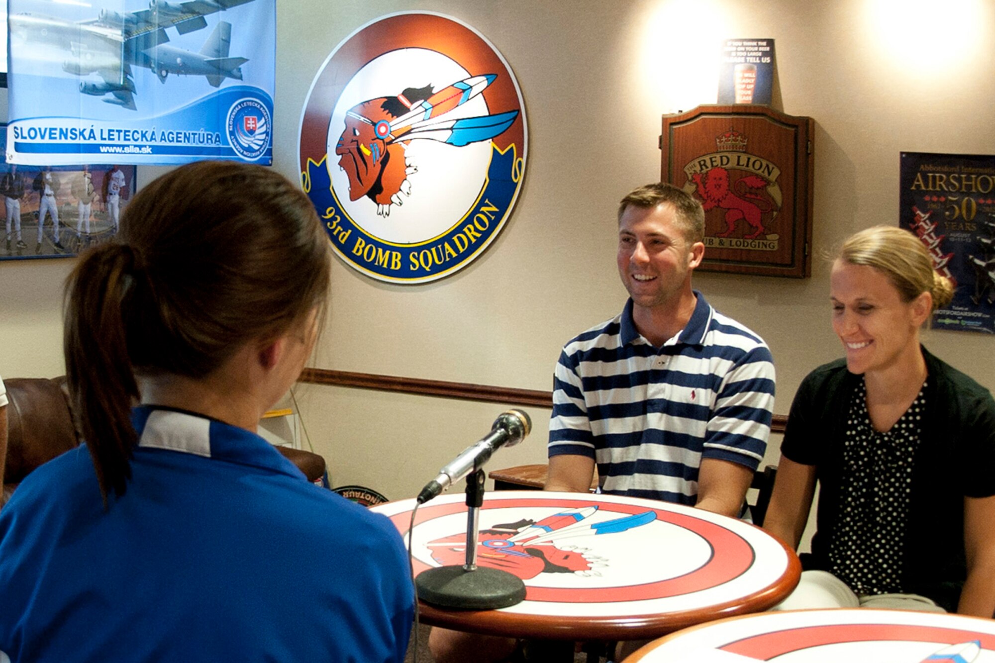 Crystal and Jonathan Rapelje share a light moment with Leslie Draffin, who is a reporter for KTAL Channel 6 in Shreveport, La., during an interview concerning a very serious subject at Barksdale Air Force Base, La., June 19, 2013. Crystal Rapelje, who is a 2nd Lt., and the Officer in Charge of the B-52 Formal Training Unit Intelligence, along with her husband Jonathan, who is a Master Sgt., and the assistant chief of operations for the fire department assigned to the 307th Civil Engineer Squadron, are facing a 20 percent loss in wages in their civilian jobs due to furloughs that may be enforced by the sequestration. Hundreds of thousands government employees face the same type of losses that are scheduled to begin on July 8, 2013. (U.S. Air Force photo by Master Sgt. Jeff Walston)       