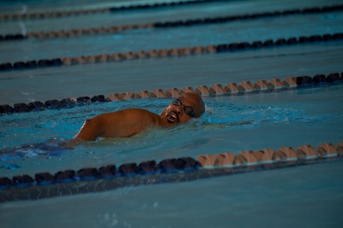 Donald McConnell, an Air Force retiree, swims laps in the Warrior Fitness Center pool June 17, 2013, at Nellis Air Force Base, Nev. The fitness center's 25-meter swimming pool is used for lap swimming from 11 a.m. to 1 p.m. daily. Swimming lessons are offered by outdoor recreation and are held at the Warrior Fitness Center’s pool. (U.S. Air Force Photo by Caitlin Kenney)