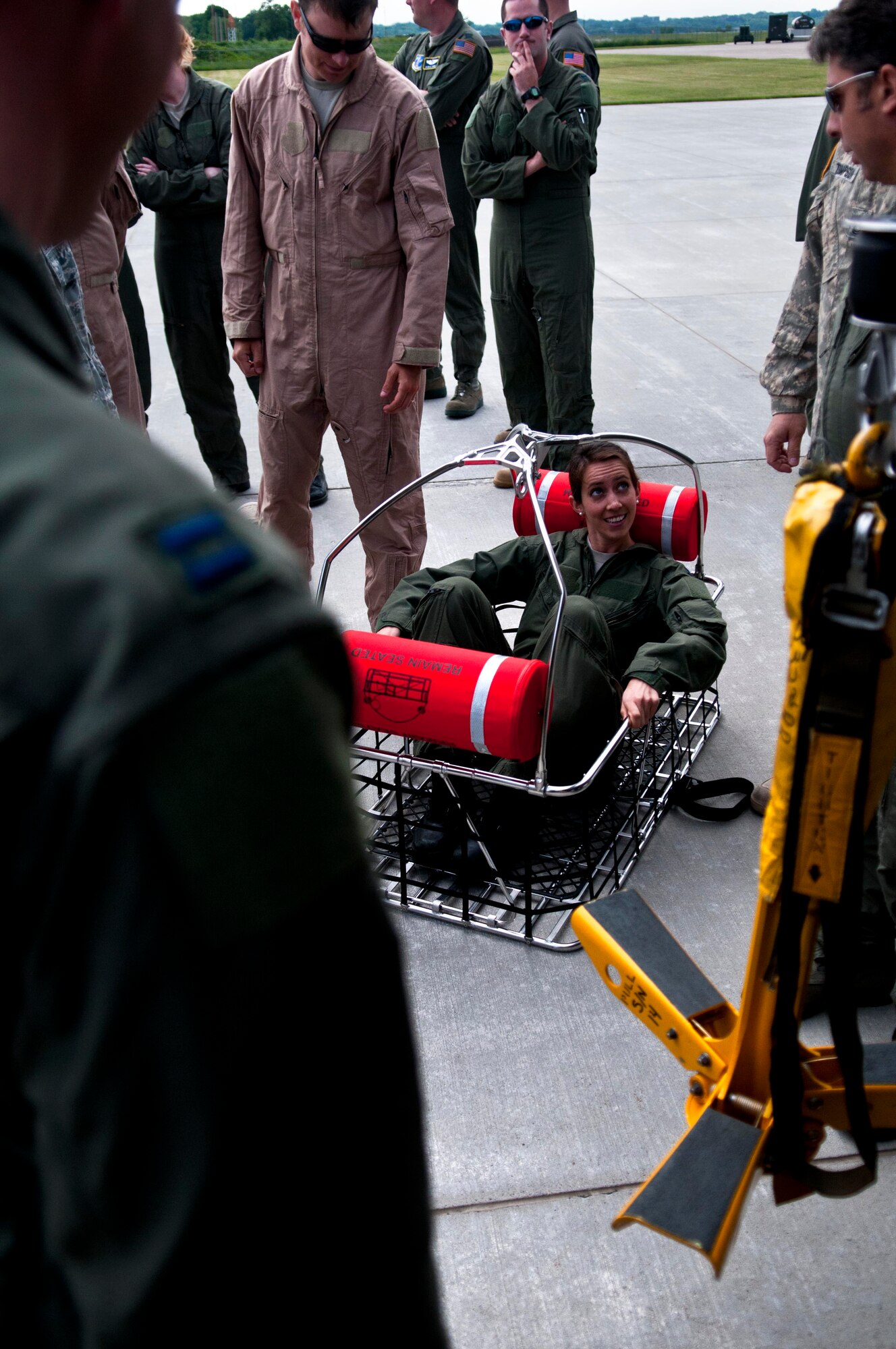 A member of the 133rd Airlift Wing tests out a rescue basket used on a Black Hawk helicopter at St. Paul, Minn., Jun. 18, 2013. 
(U.S. Air National Guard photo by Staff Sgt. Austen Adriaens/Released)
