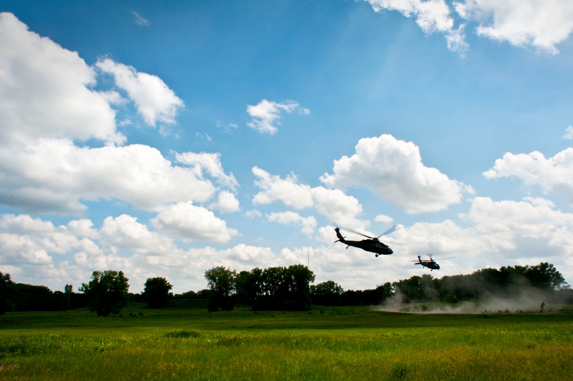 Two Black Hawk helicopters from the Minnesota Army National Guard make their final departure in Arden Hills, Minn., Jun. 18, 2013. 
(U.S. Air National Guard photo by Staff Sgt. Austen Adriaens/Released)
