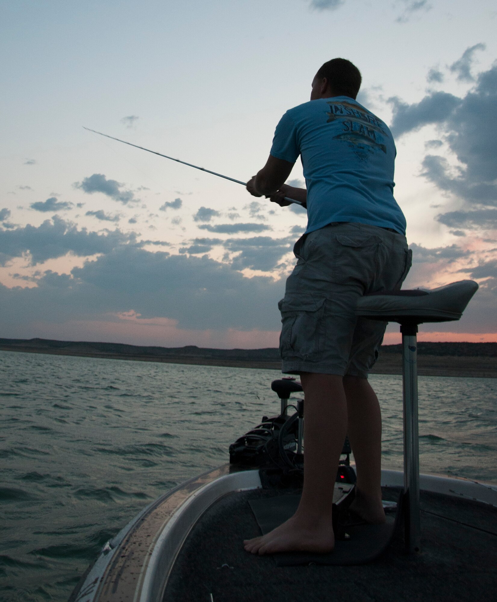 Senior Airman George Trosper, 47th Operations Support Squadron weather forecaster, casts a line into Lake Amistad early in the morning near Del Rio, Texas, May 19, 2013. Fishing is a relaxing sport for Trosper in which he can unwind after a long work week. (U.S. Air Force photo/Airman 1st Class Jimmie D. Pike)