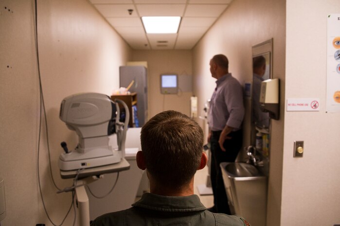 Maj. William McDougall, 17th Airlift Squadron pilot, performs a contrast-vision test June 18, 2013, at Joint Base Charleston – Air Base, S.C. Optometrists examine, diagnose, treat and manage diseases, injuries and disorders of the visual system, the eye and associated structures, as well as identify related systemic conditions affecting the eye. (U.S. Air Force photo/ Senior Airman George Goslin)  