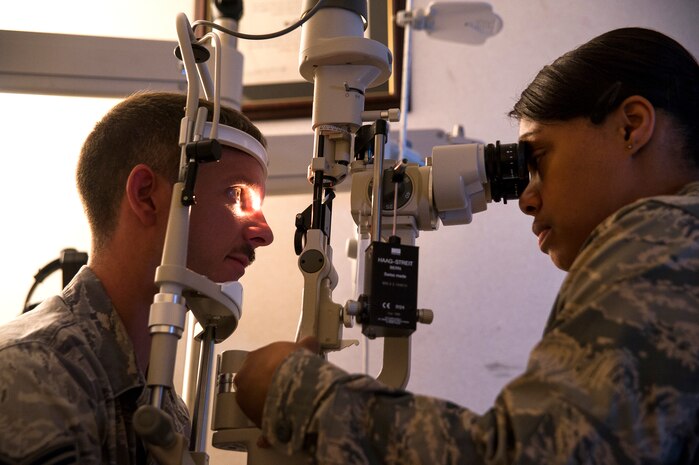 Maj. Syreeta Lawrence, 628th Medical Group optometrist, performs an eye exam on a patient June 17, 2013, at Joint Base Charleston – Air Base, S.C. Optometrists examine, diagnose, treat and manage diseases, injuries and disorders of the visual system, the eye, and associated structures, as well as identify related systemic conditions affecting the eye. (U.S. Air Force photo/ Senior Airman George Goslin)