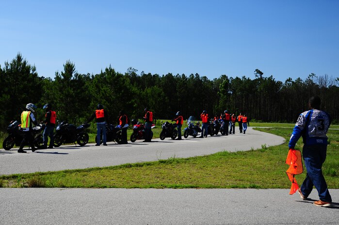 Motorcyclists prepare to train during the Joint Base Charleston Street Riding Skills Mentorship Program's motorcycle training event June 14, 2013, at JB Charleston - Weapons Station, S.C. The program is structured to provide beginner, intermediate and advanced motorcycle riders challenging riding exercises commensurate with their skill level. This three-level training plan provides emergency and lifesaving exercises to practice at normal street speeds, giving motorcycle riders the experience to perform these maneuvers in normal traffic conditions when necessary. (U.S. Air Force photo/ Airman 1st Class Chacarra Neal)