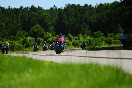 Motorcyclists ride on the training  course during the Joint Base Charleston Street Riding Skills Mentorship Program motorcycle training event June 14, 2013, at JB Charleston - Weapons Station, S.C. The program is structured to provide beginner, intermediate and advanced motorcycle riders challenging riding exercises commensurate with their skill level. This three-level training plan provides emergency and lifesaving exercises to practice at normal street speeds, giving motorcycle riders the experience to perform these maneuvers in normal traffic conditions when necessary. (U.S. Air Force photo/ Airman 1st Class Chacarra Neal)