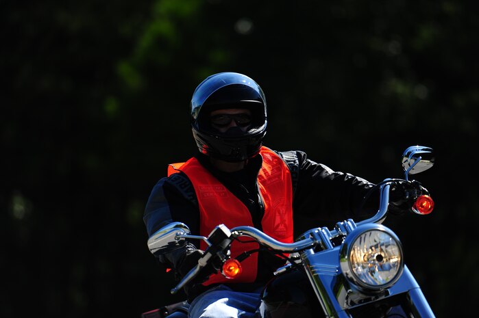 Col. John Colombo, Air Force Reserve Officer Training Corps Detachment 765th commander, rides a motorcycle during a training course June 14, 2013, at Joint Base Charleston – Weapons Station, S.C. The Joint Base Charleston Street Riding Skills Mentorship Program was created as a structured, training session focusing on sharing information, gaining valuable street-riding knowledge and practicing fundamental riding skills in a safe environment. (U.S. Air Force photo/ Airman 1st Class Chacarra Neal)