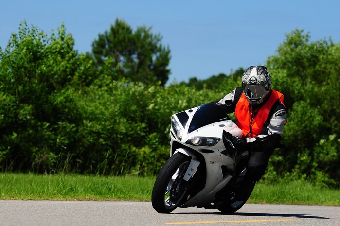 Senior Airman Clayton Berry, 437th Aircraft Maintenance Squadron crew chief, negotiates a corner during a training exercise June 14, 2013, at Joint Base Charleston – Weapons Station, S.C. The Joint Base Charleston Street Riding Skills Mentorship Program was created as a structured, training session focusing on sharing information, gaining valuable street-riding knowledge and practicing fundamental riding skills in a safe environment. (U.S. Air Force photo/ Airman 1st Class Chacarra Neal)