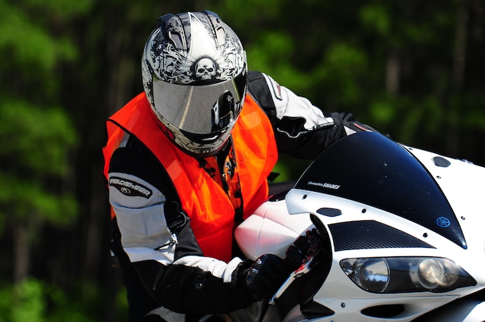 Senior Airman Clayton Berry, 437th Aircraft Maintenance Squadron crew chief, leans his motorcycle into a corner during a training exercise June 14, 2013, at Joint Base Charleston – Weapons Station, S.C. The JB Charleston Street Riding Skills Mentorship Program was created as a structured, training session, focusing on sharing information, gaining valuable street-riding knowledge and practicing fundamental riding skills in a safe environment. (U.S. Air Force photo/ Airman 1st Class Chacarra Neal)