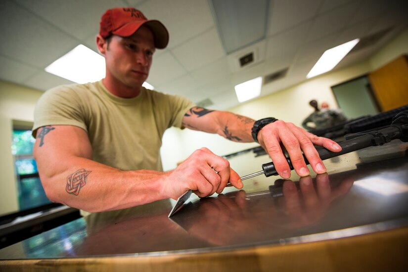 Staff Sgt. Adam Thompson, 628th Security Forces Squadron Combat Arms Training and Maintenance instructor, uses a specialized gauge to inspect the muzzle of an M-16 rifle for corrosion June 13, 2013, at Joint Base Charleston – Air Base, S.C. The CATAM instructors go through each part of the gun looking for cracks, corrosion or general damage to the weapons. (U.S. Air Force photo/ Senior Airman Dennis Sloan)