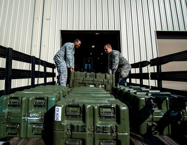 Senior Airman Robert Reynolds, 628th Logistics Readiness Squadron Individual Protective Equipment technician, moves four cases of M-16 rifles from the LRS vault to a truck to be transported to Airmen at the 628th Security Forces Squadron Combat Arms Training for an inspection June 13, 2013, at Joint Base Charleston – Air Base, S.C. The CATAM instructors are required to inspect all of the M-16s held in the vault once every year. (U.S. Air Force photo/ Senior Airman Dennis Sloan)