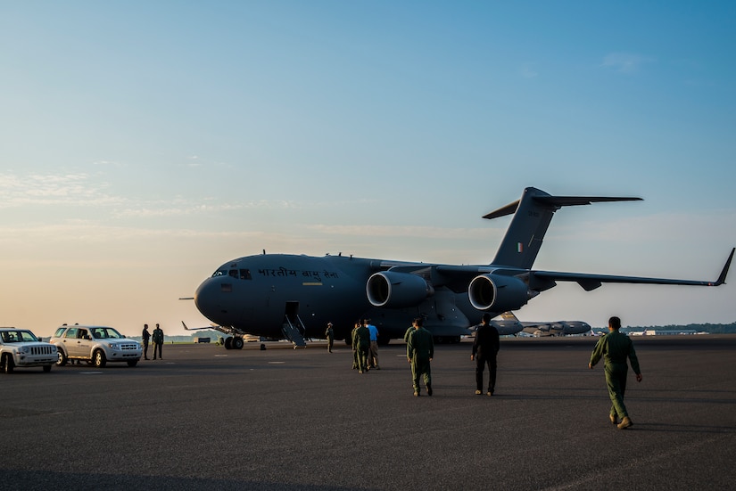 Members of the Indian air force C-17 crew walk toward their new aircraft June 13, 2013, at Joint Base Charleston – Air Base, S.C. The Indian air force received its first of 10 C-17 Globemaster IIIs from Boeing, with the remainder being delivered through 2014. (U.S. Air Force photo/ Senior Airman George Goslin)
