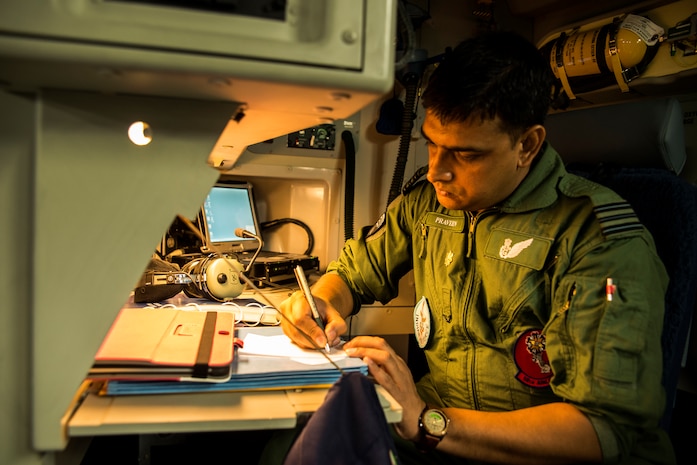 Indian air force Wing Commander Praveen reviews cargo logs on the first IAF Globemaster III June 13, 2013, at Joint Base Charleston – Air Base, S.C. The Indian air force received its first of 10 C-17 Globemaster IIIs from Boeing, with the remainder being delivered through 2014. (U.S. Air Force photo/ Senior Airman George Goslin)