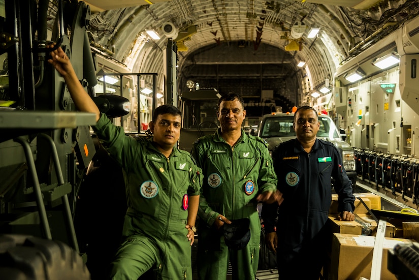 (Left) Indian air force Wing Commander Praveen , (middle) Warrant Officer Ap Tripathi, and (right) Junior Warrant Officer Prakish Chand, stand in the cargo bay of the first IAF C-17 Globemaster III June 13, 2013, at Joint Base Charleston – Air Base, S.C. The Indian air force received its first of 10 C-17 Globemaster IIIs from Boeing, with the remainder being delivered through 2014. (U.S. Air Force photo/ Senior Airman George Goslin)
