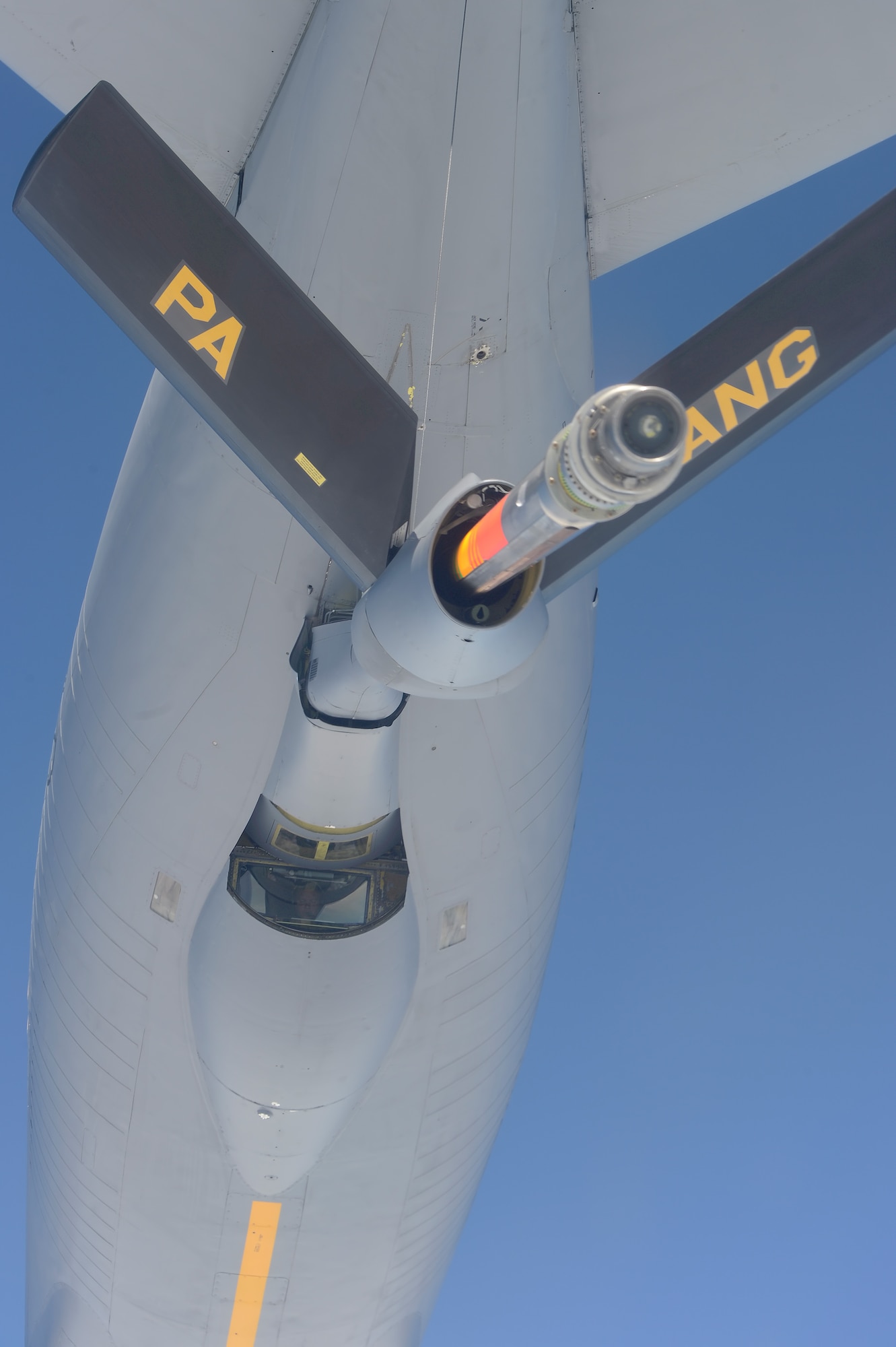 A KC-135R Stratotanker of the 171th Air Refueling Wing, Pennsylvania Air National Guard conducting in-flight refueling for a C-17A flown by members of the 326th Airlift Squadron, 512th Airlift Wing, Air Force Reserve Command, over the Eatern United States during a training mission on June 18, 2013. The KC-135's boom operator was Tech. Sgt. Kirk Boring who can be seen peering down from the boom-pod  (U.S. Air Force photo/Greg L. Davis)