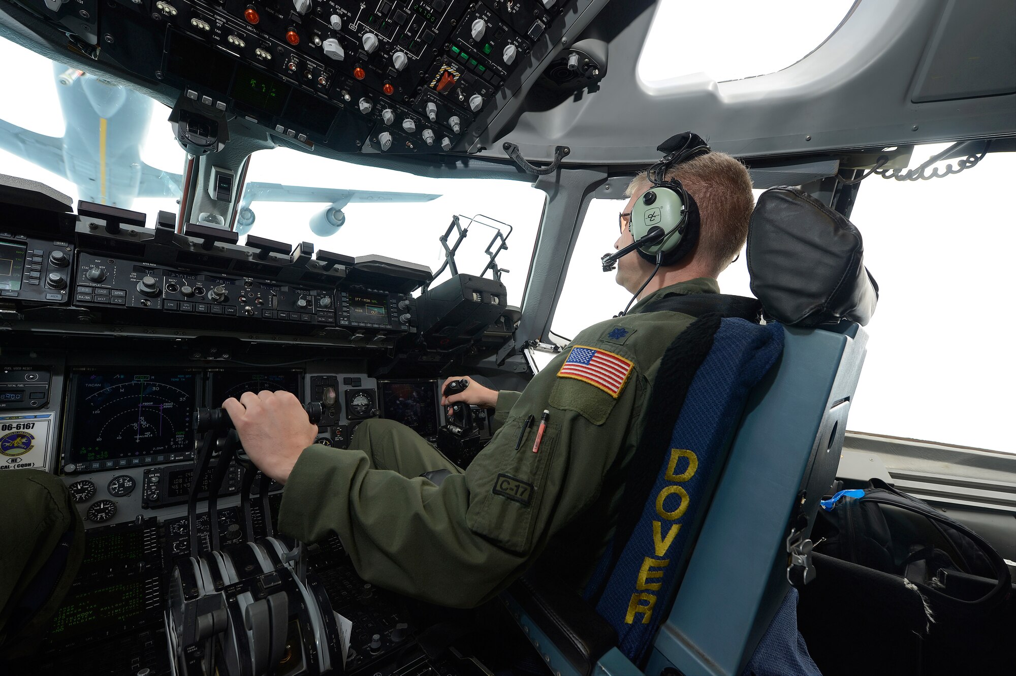 Lt. Col. Hugh Hamiliton of the 326th Airlift Squadron, 512th Airlift Wing, Air Force Reserve Command, carefully adjusts the throttles of a C-17A Globemaster III during an in-flight refueling from a KC-135R Stratotanker of the 171st Air Refueling Wing, Pennsylvania Air National Guard during a training mission from Dover Air Force Base, Del., on June 18, 2013.  Dover's fleet of C-5M and C-17A's are shared by active duty (436th) and reserve (512th) Wings. (U.S. Air Force photo/Greg L. Davis)