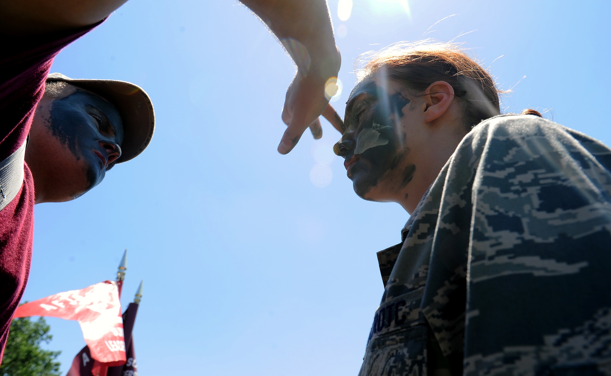The Junior Reserve Officers’ Training Corps cadets, paint their faces at Scott Air Force Base, Ill. June 12, 2013. The cadets visited the Security Forces Squadron for the day to experience the various aspects of being a military cop.  Scott AFB has been welcoming JROTC cadets on base for over 10 years to gain an understanding of different jobs the military has to offer. JROTC is a Federal program sponsored by the United States Armed Forces in high schools. (U.S. Air Force photo/Airman 1st Class Jaeda Waffer) 