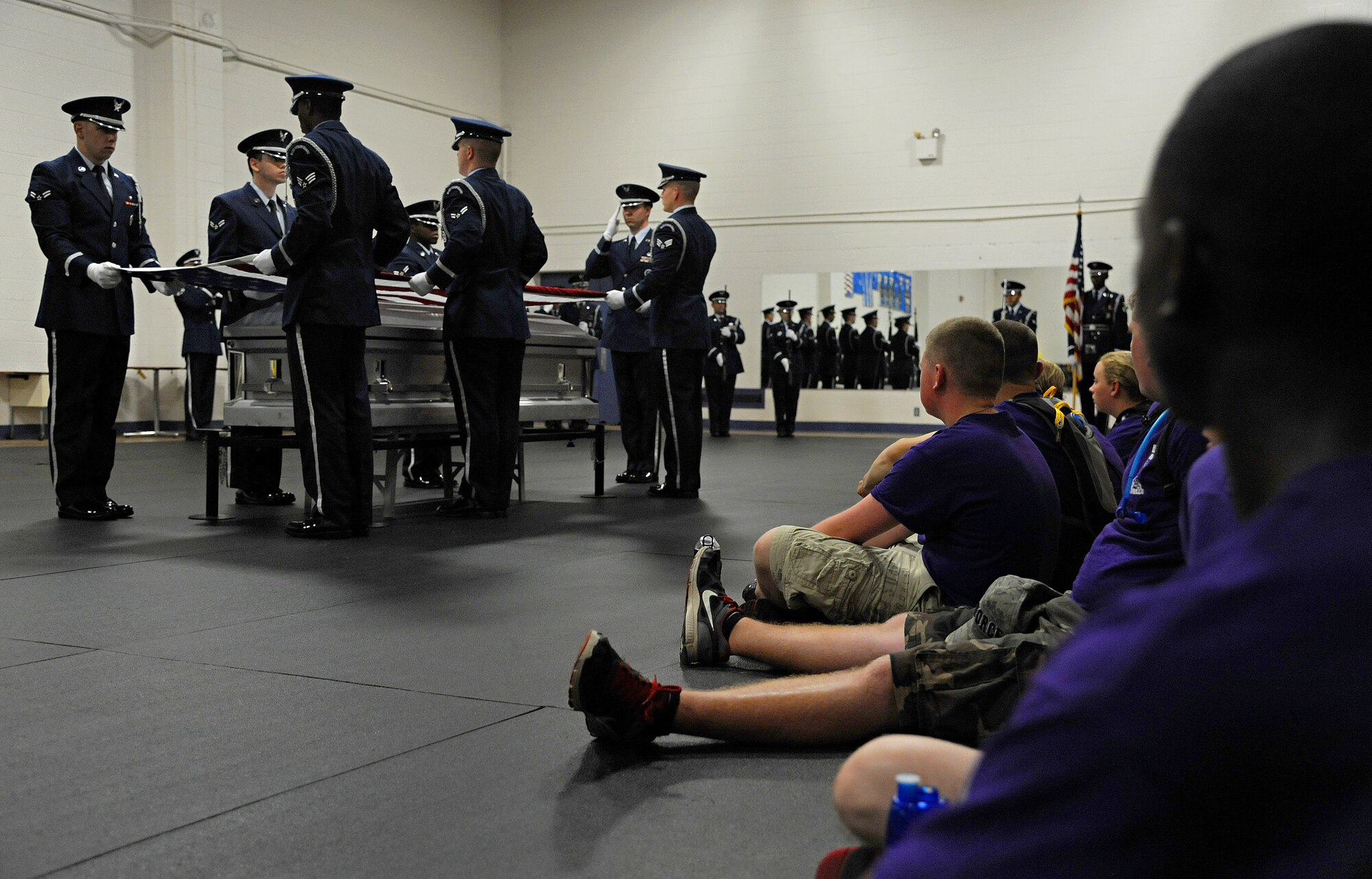 The Scott Air Force Base Honor Guard demonstrates an active duty funeral for Junior Reserve Officer Training Corps cadets June 11 at Scott Air Force Base, Ill. The cadets visited Scott for a week and toured different career fields where they gained knowledge and experience within each job. (U.S. Air Force photo/Airman Kristina Forst)