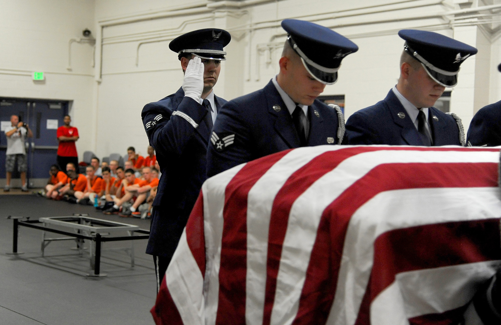 Junior Reserve Officer Training Corps cadets observe the Scott Air Force Base Honor Guard as they demonstrate an active duty funeral June 11 at Scott Air Force Base, Ill. The cadets visited Scott for a week and toured different career fields where they gained knowledge and experience within each job. (U.S. Air Force photo/Airman Kristina Forst)