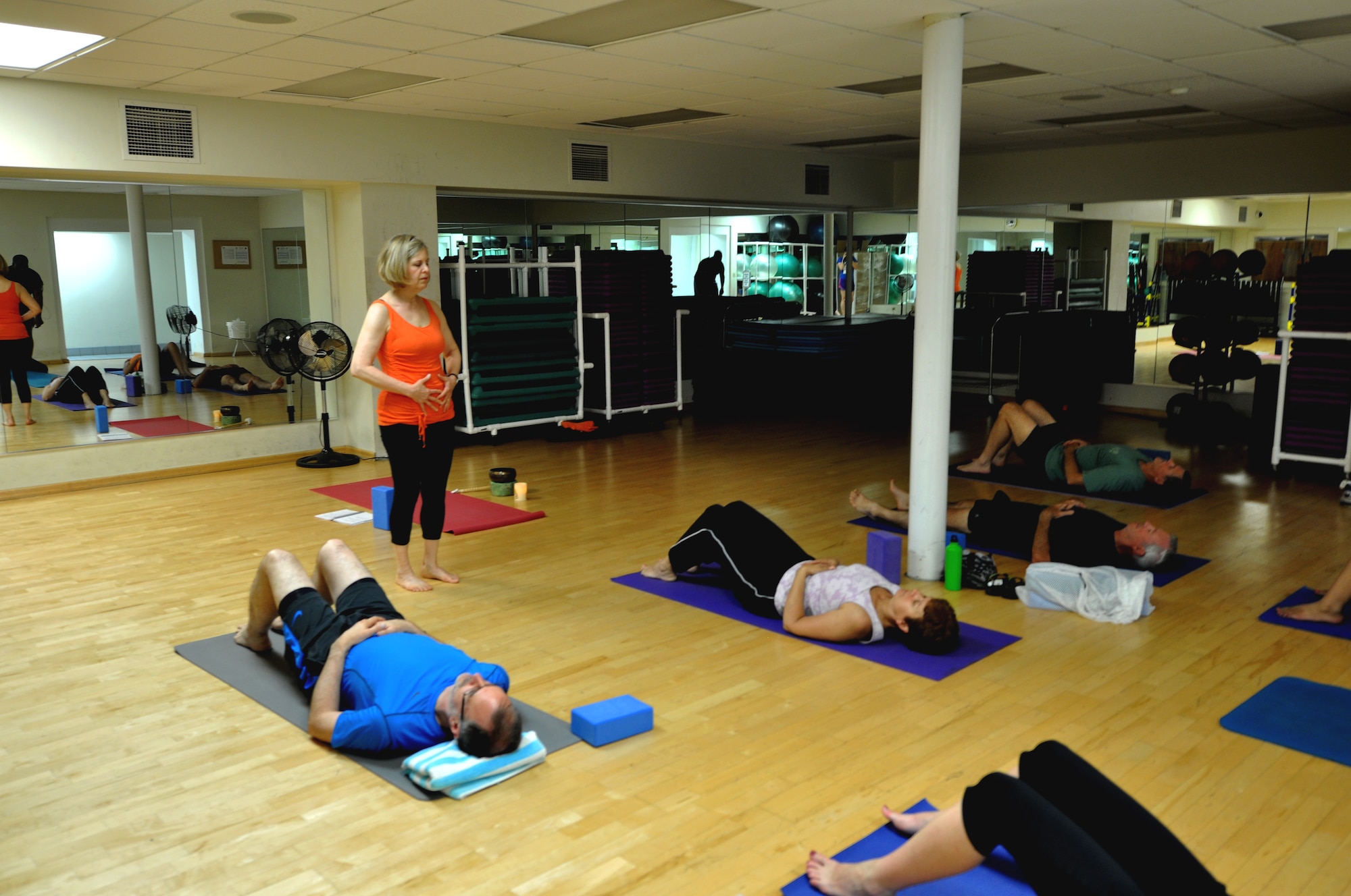 “Introduction to yoga” class taught by Blice-Baum which occurs every Tuesday 5:15 – 6:15 p.m. works on breathing exercises before doing strength training exercises at the Fitness Center June 11th. Blice-Baum is now leading “Improving your running with yoga” course every Tuesday and Thursday 11:30 a.m. to 12:00 p.m. for the next six weeks. (U.S. Air Force photo/Airman Megan Friedl)