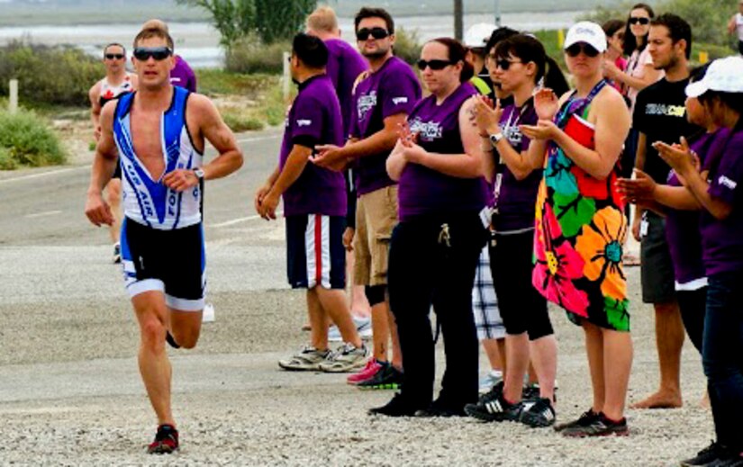 U.S. Air Force Capt. Mitchell Kieffer, Air Combat Command operations research analyst, nears the finish line of the Armed Forces Triathlon, June 1, 2013, at Naval Base Ventura County, Point Mugu, Calif. Kieffer was one of the 10 male triathletes chosen to compete on the Air Force team. (Courtesy photo/Released)