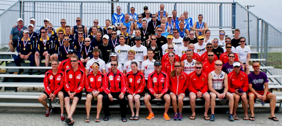 Competitors from the U.S. Air Force, Army, Marines, Navy, and athletes from the Canadian military forces sit together after the Armed Forces Triathlon, June 1, 2013, at Naval Base Ventura County, Point Mugu, Calif. The triathlon was an “Olympic” distance triathlon, consisting of nearly a mile swim, 24.8-mile bicycle ride and 6.2 mile run. (Courtesy photo/Released)